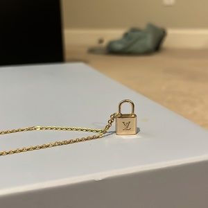 Louis Vuitton gold lock necklace for UNICEF